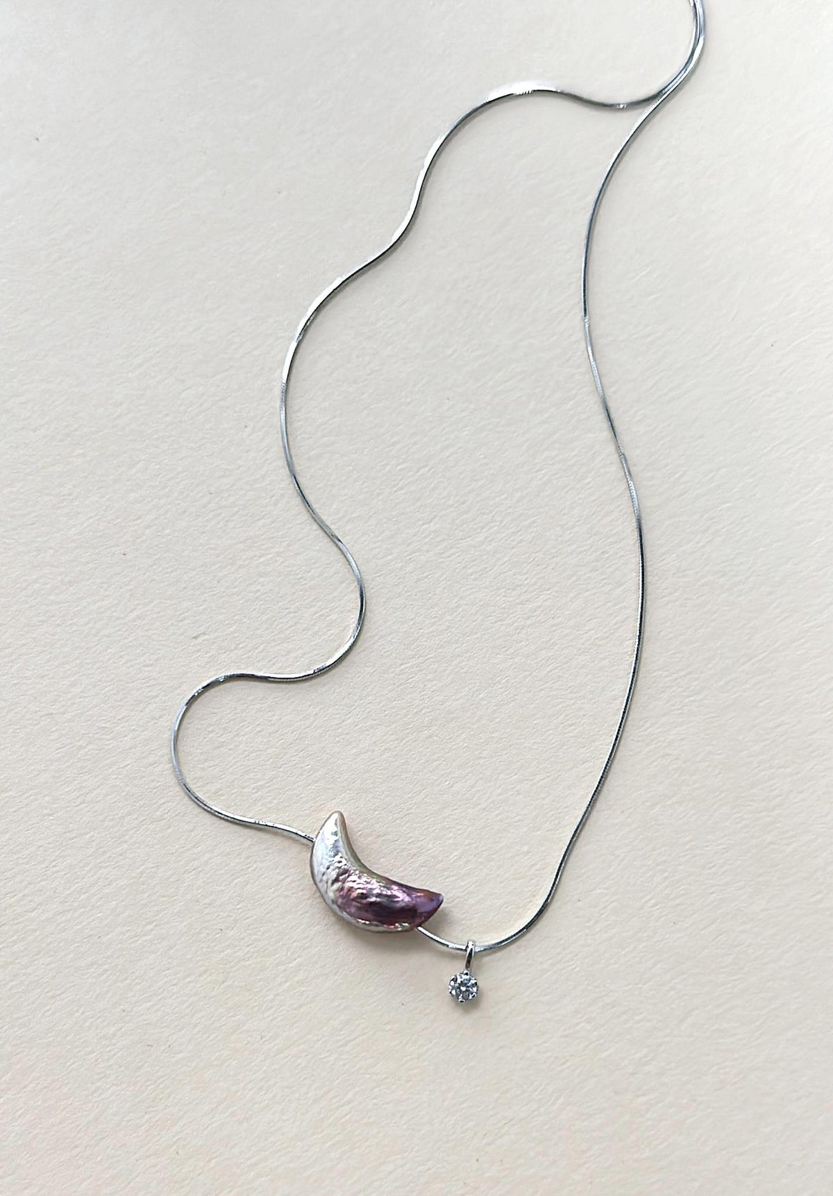 Iridescent crescent moon baroque pearl necklace in 925 sterling silver